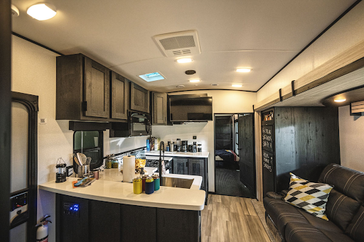 The rustic yet elegant interior of the Stryker toy-hauler from Cruiser RV.